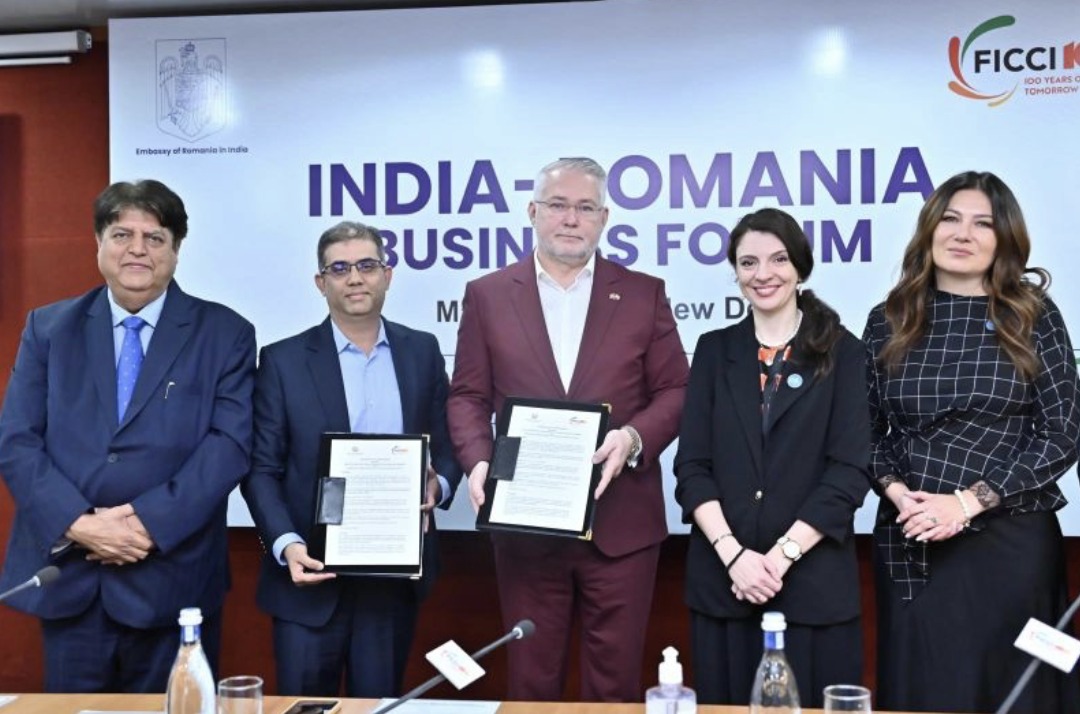 Morten Reimers holding a signed cooperation agreement at the India–Romania Business Forum in New Delhi
